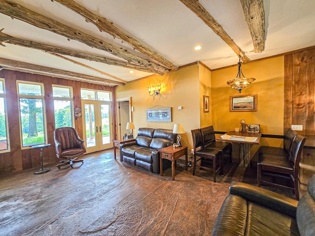 living room with beam ceiling, dark wood-type flooring, and french doors