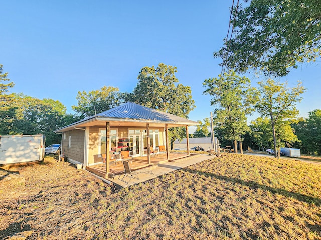 rear view of property featuring a patio