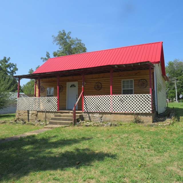 log-style house with a front lawn and a porch