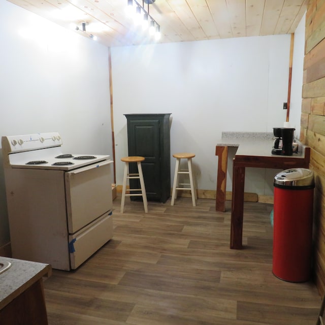 office with wood walls, wooden ceiling, and dark hardwood / wood-style floors