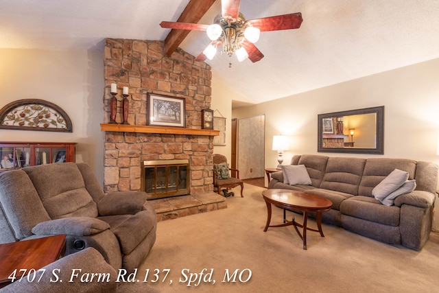 living room with ceiling fan, vaulted ceiling with beams, a stone fireplace, and carpet flooring