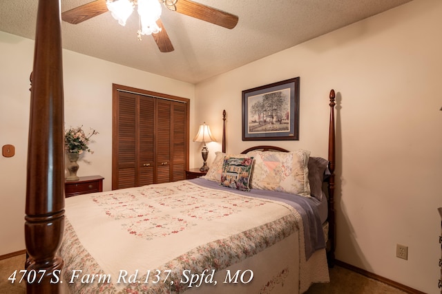 carpeted bedroom featuring ceiling fan, a closet, and a textured ceiling