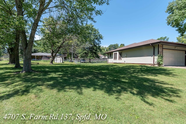 view of yard with a garage