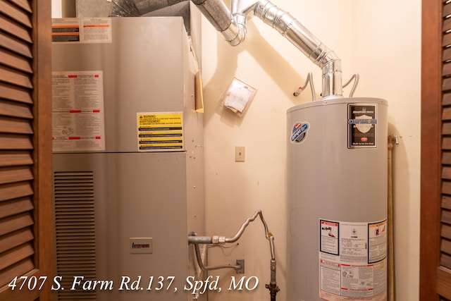 utility room featuring water heater and heating unit