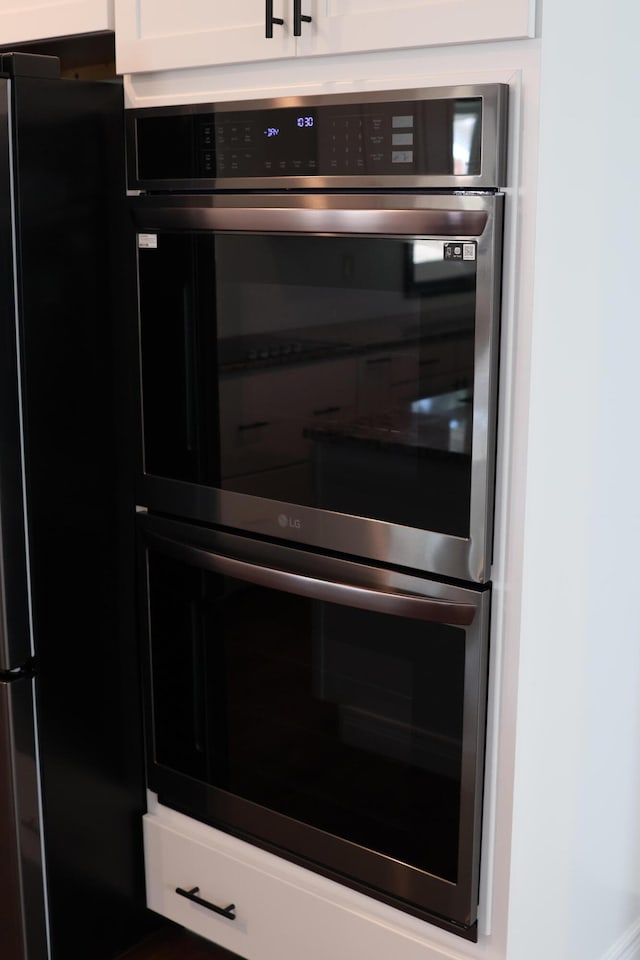 interior details featuring white cabinetry and stainless steel appliances