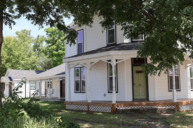 327 E Chestnut St, Bolivar, MO 65613 - view of front facade featuring roof with shingles and covered porch