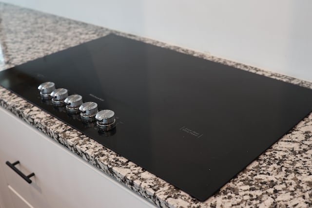 room details featuring black electric stovetop