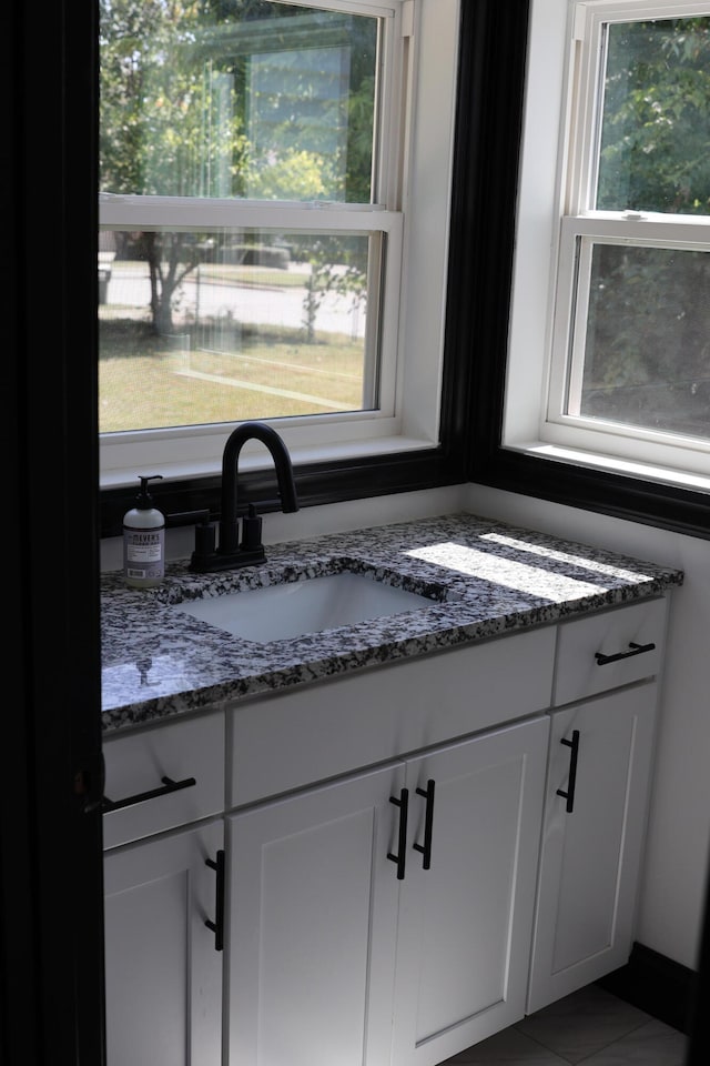 bathroom featuring vanity and tile patterned flooring