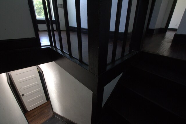 stairway featuring hardwood / wood-style flooring