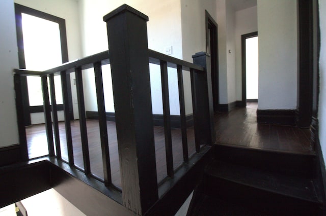327 E Chestnut St, Bolivar, MO 65613 - stairs with wood finished floors, a wealth of natural light, and baseboards
