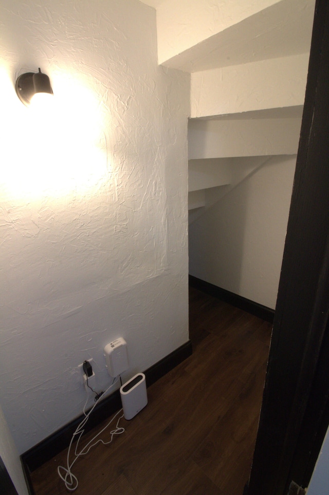 327 E Chestnut St, Bolivar, MO 65613 - hallway featuring baseboards and dark wood-type flooring
