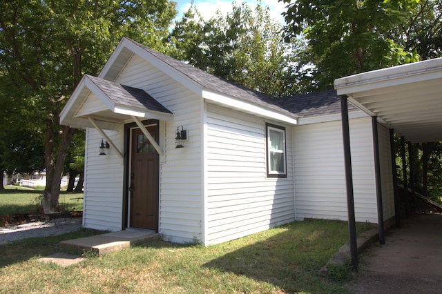 view of outbuilding with a lawn