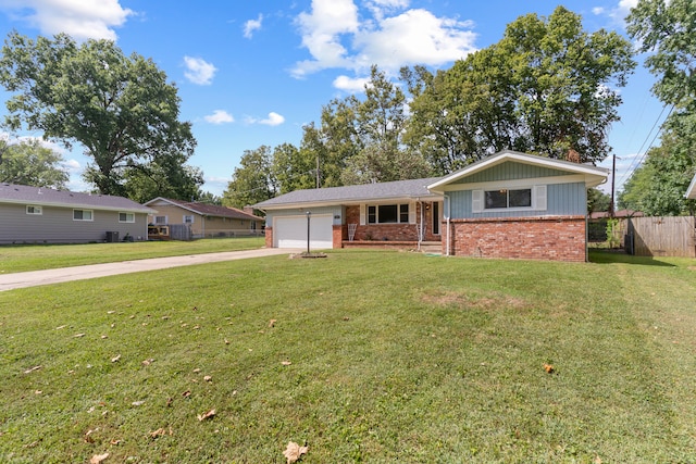 single story home featuring a front lawn and a garage