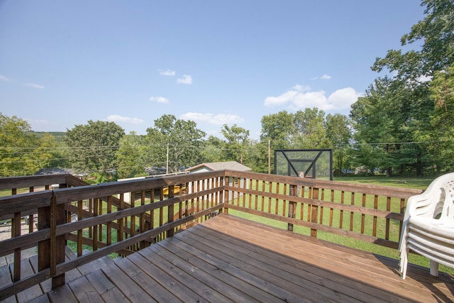 wooden terrace with a lawn