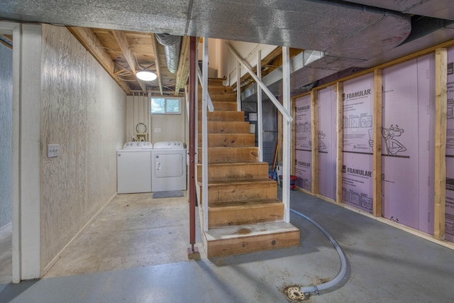 below grade area featuring stairway and separate washer and dryer