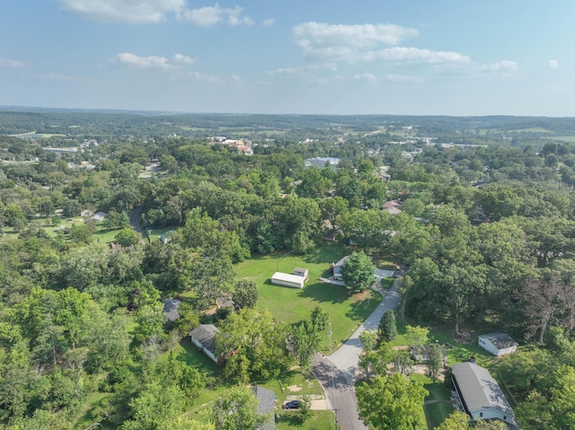 drone / aerial view featuring a view of trees