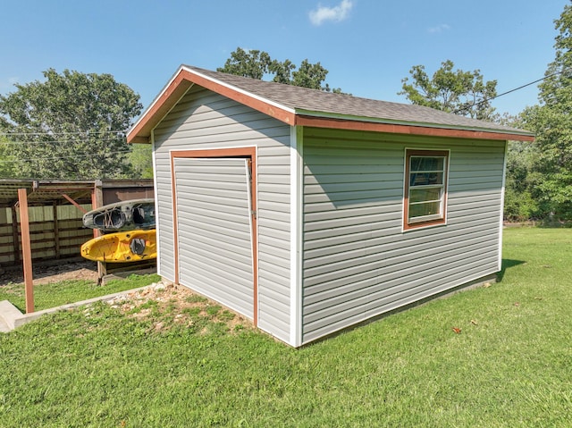 view of outdoor structure with a lawn