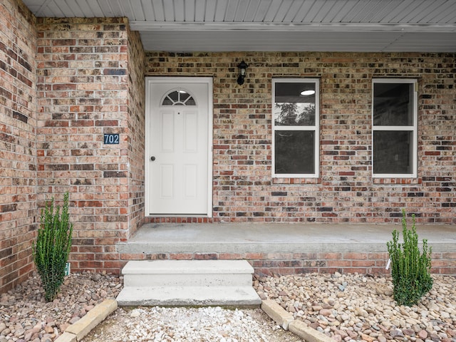 702 E Buffalo St, Bolivar, MO 65613 - property entrance featuring brick siding