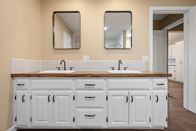 bathroom featuring hardwood / wood-style floors and vanity