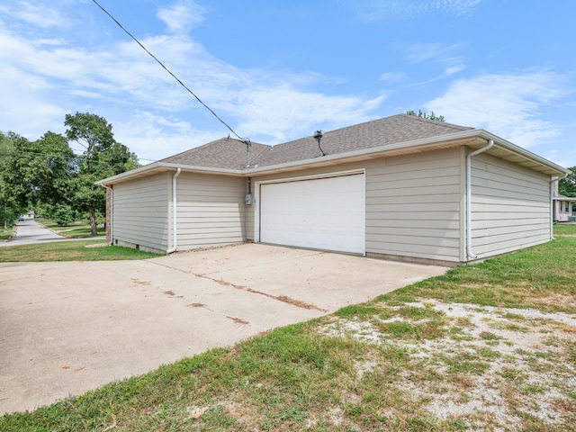 garage with a lawn