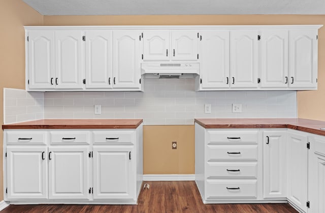 kitchen with backsplash, dark hardwood / wood-style flooring, and white cabinetry