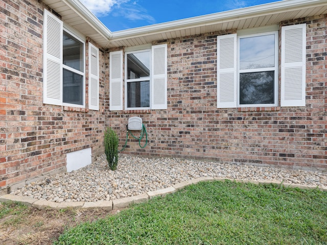 702 E Buffalo St, Bolivar, MO 65613 - view of side of home with brick siding and crawl space