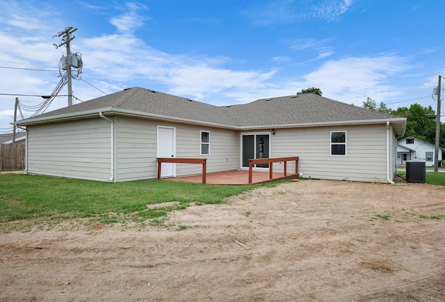 702 E Buffalo St, Bolivar, MO 65613 - back of property featuring a yard, a patio area, and roof with shingles