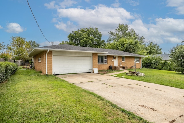 ranch-style home with a front yard and a garage