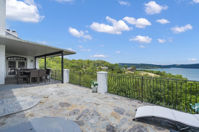 view of patio / terrace with a water view