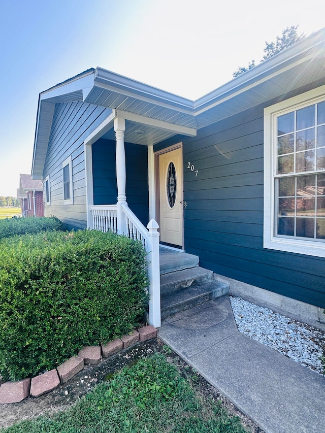 property entrance featuring a porch