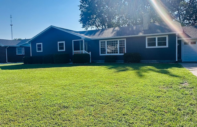 ranch-style home with a front yard and a garage