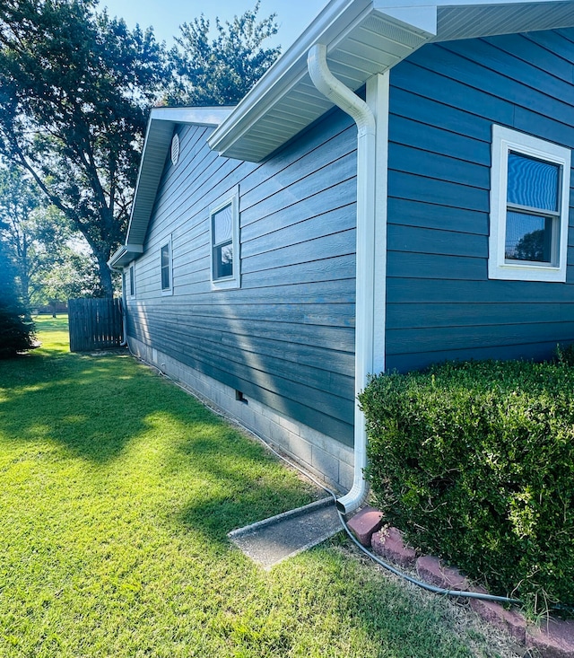 view of home's exterior with a lawn