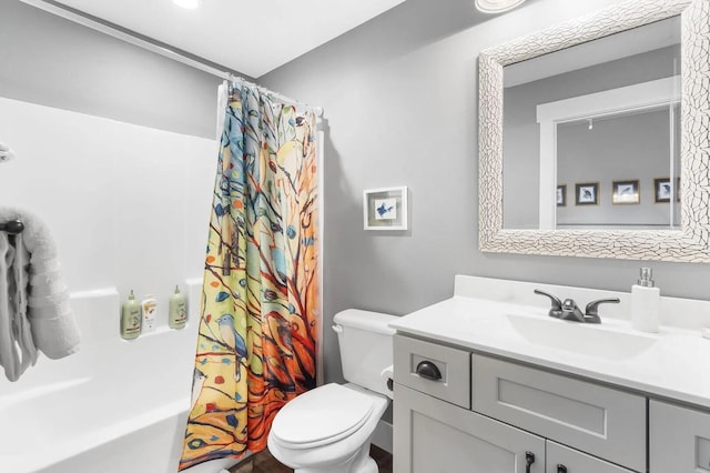 full bathroom with shower / bath combo, vanity, and toilet