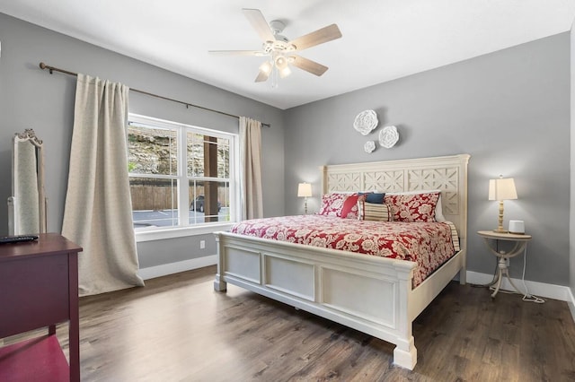 bedroom featuring ceiling fan and dark hardwood / wood-style flooring