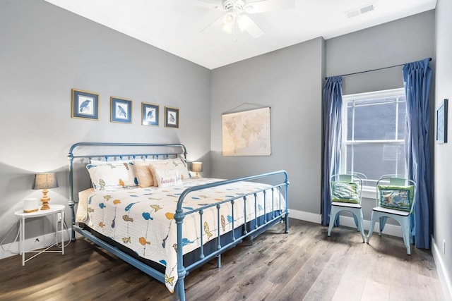 bedroom with ceiling fan and wood-type flooring