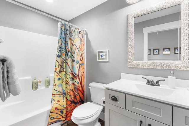 full bathroom featuring vanity, toilet, and shower / tub combo with curtain