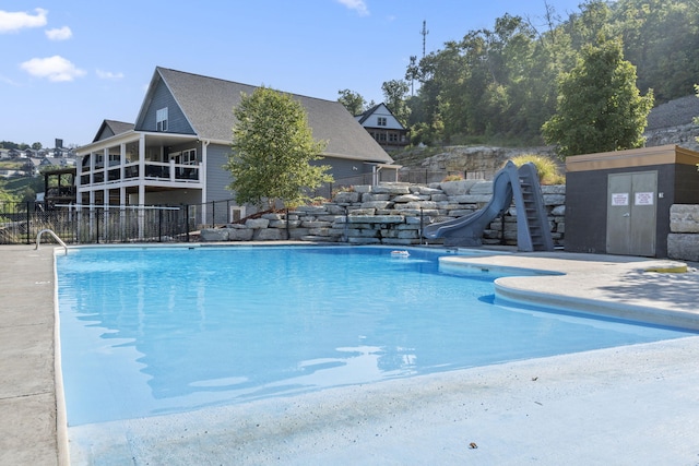 view of swimming pool featuring a water slide