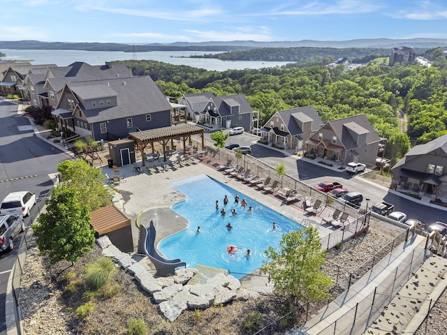 birds eye view of property with a water view