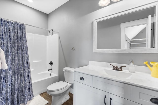 full bathroom featuring shower / bath combination with curtain, vanity, toilet, and hardwood / wood-style flooring