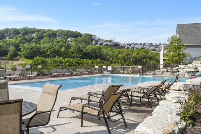 view of swimming pool with a patio area