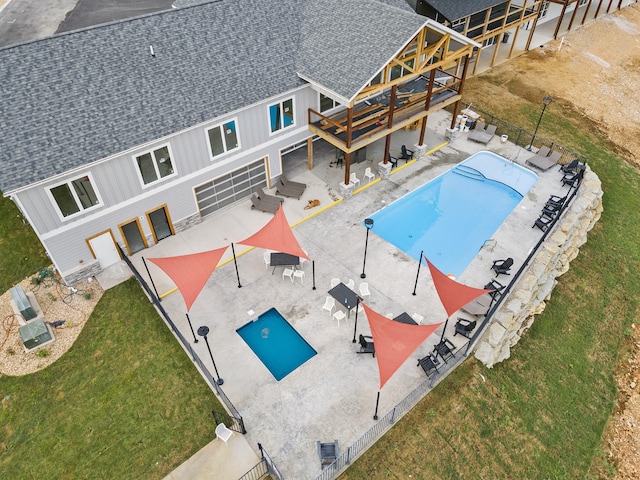 view of pool with a yard and a patio area