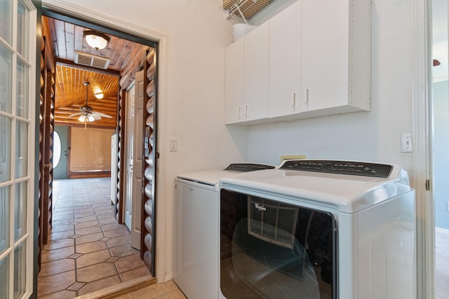 washroom featuring ceiling fan, light tile patterned floors, washing machine and clothes dryer, cabinets, and wooden ceiling