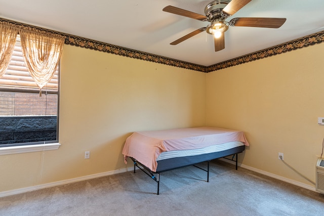 bedroom featuring ceiling fan and carpet floors