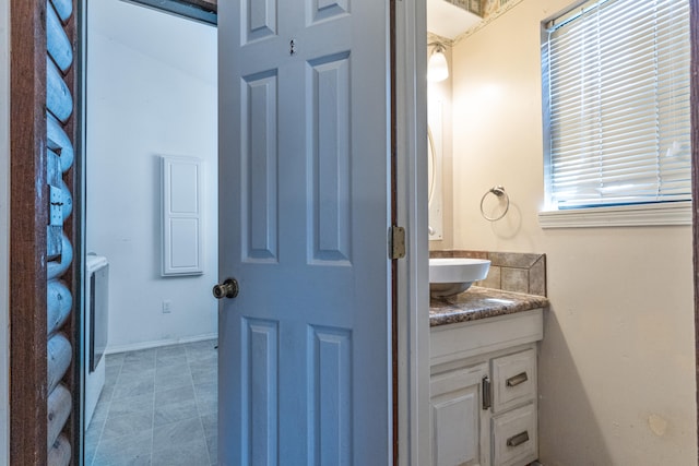 bathroom featuring separate washer and dryer and vanity