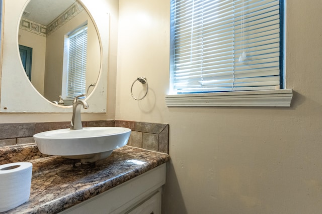 bathroom with vanity and plenty of natural light