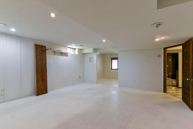 basement featuring a textured ceiling