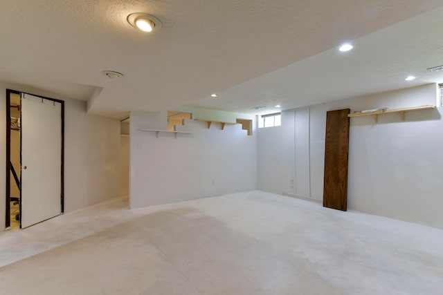 basement with a textured ceiling