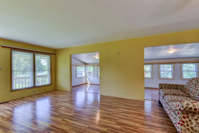 unfurnished living room with light hardwood / wood-style flooring