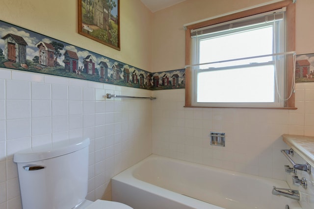 full bathroom featuring toilet, vanity,  shower combination, and tile walls