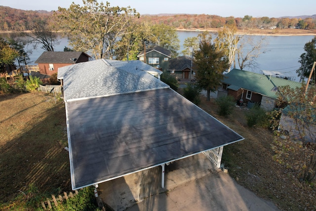 birds eye view of property with a water view